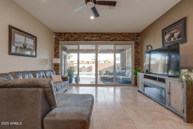 tiled living room featuring ceiling fan