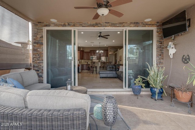 view of patio / terrace featuring ceiling fan