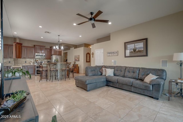 living room with light tile patterned floors and ceiling fan