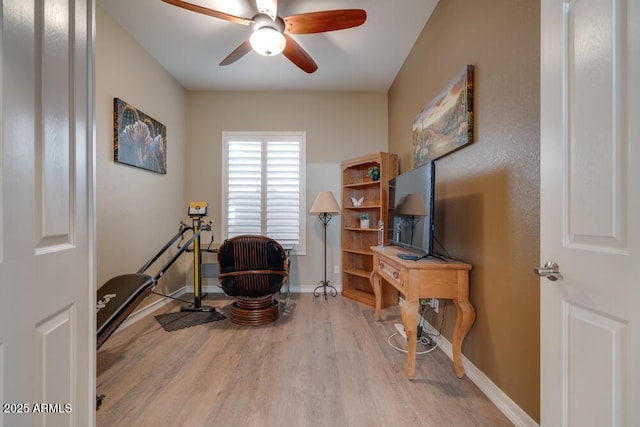 sitting room with ceiling fan and light wood-type flooring