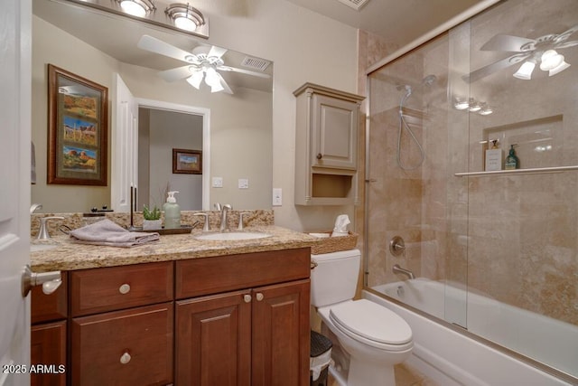 full bathroom with enclosed tub / shower combo, vanity, ceiling fan, and toilet