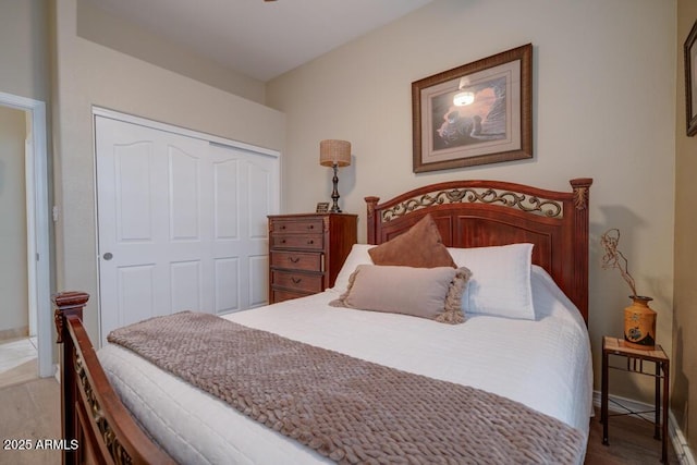 bedroom featuring a closet and light wood-type flooring