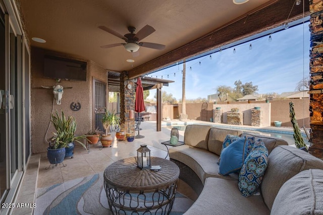 sunroom with ceiling fan