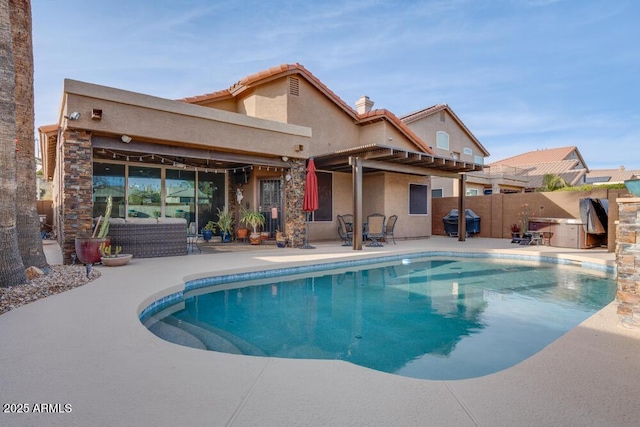 view of swimming pool featuring area for grilling, an outdoor hangout area, and a patio area