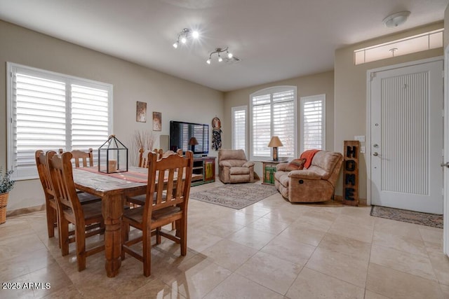 dining area with light tile patterned flooring