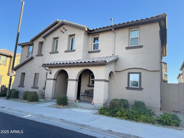 view of front of home with stucco siding and a tiled roof