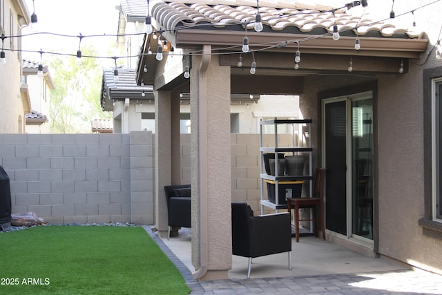 view of patio featuring fence