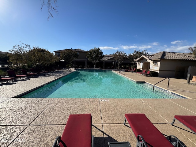 community pool featuring a patio area