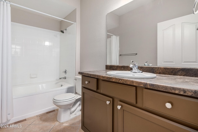 full bathroom featuring tile patterned floors, vanity, shower / tub combo, and toilet