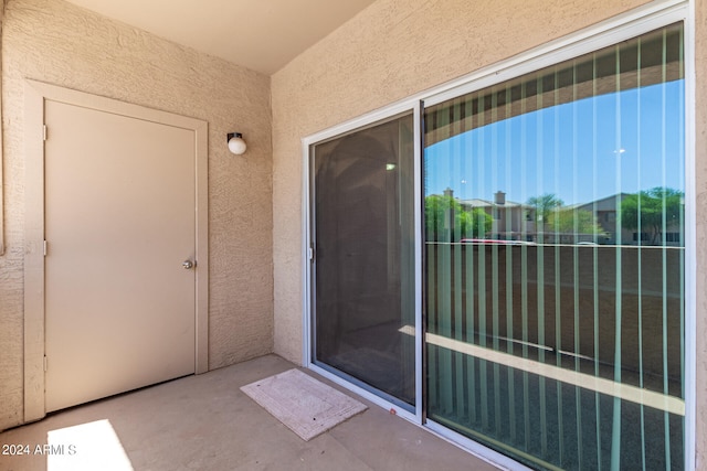 doorway to property featuring a balcony