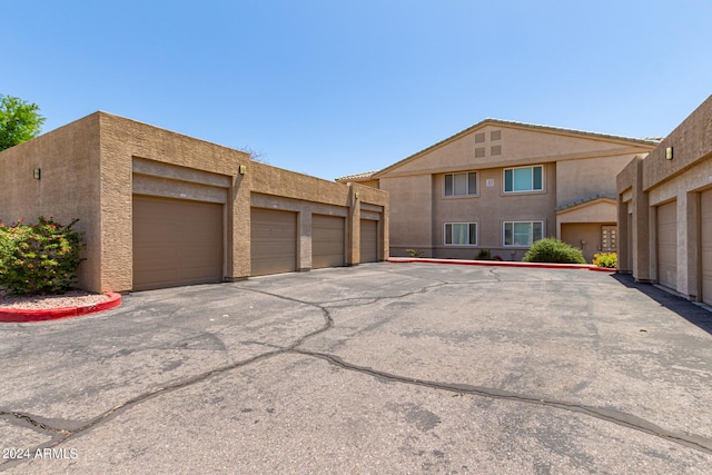 view of property exterior with a garage