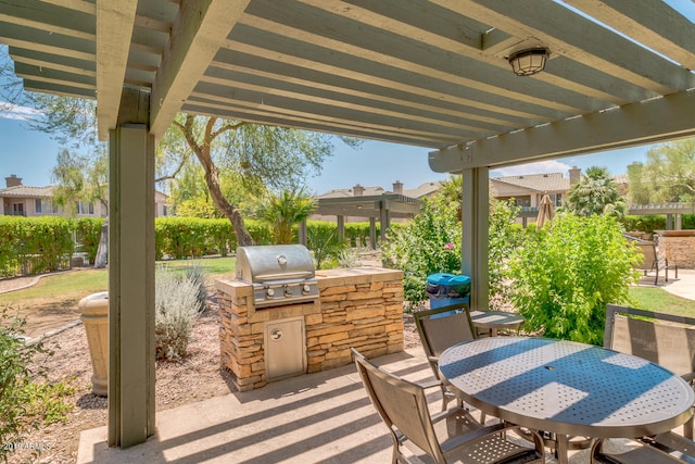 view of patio / terrace featuring a pergola, a grill, and exterior kitchen