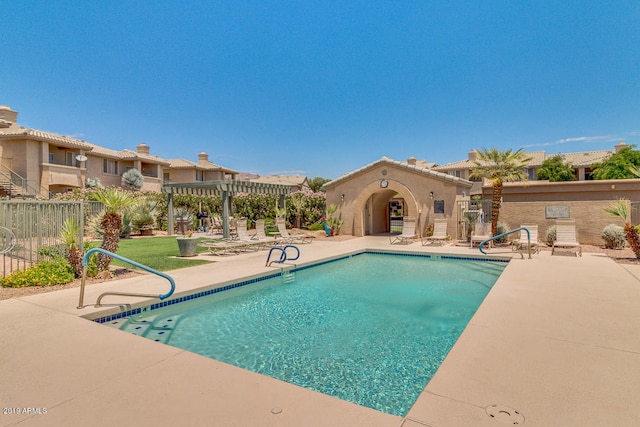 view of swimming pool featuring a pergola and a patio area