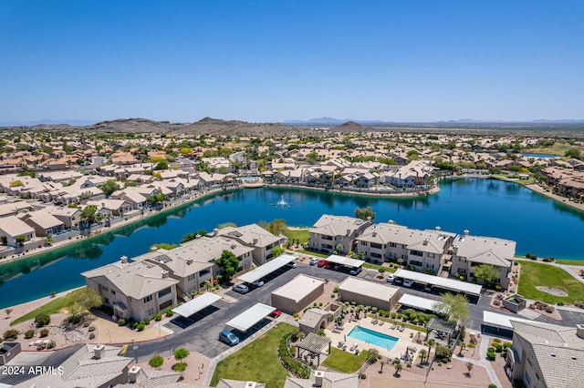 aerial view featuring a water and mountain view