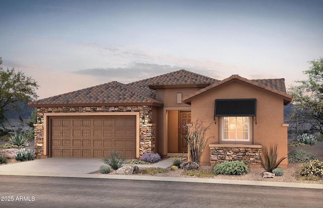 7714 W Meadowlark Way, Florence, AZ 85132 - mediterranean / spanish home featuring an attached garage, concrete driveway, stucco siding, a tile roof, and stone siding