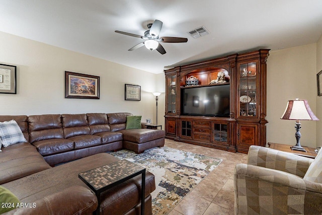 living room featuring light tile patterned floors and ceiling fan