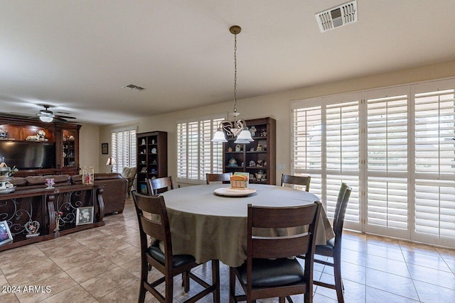 dining space featuring light tile patterned flooring and ceiling fan