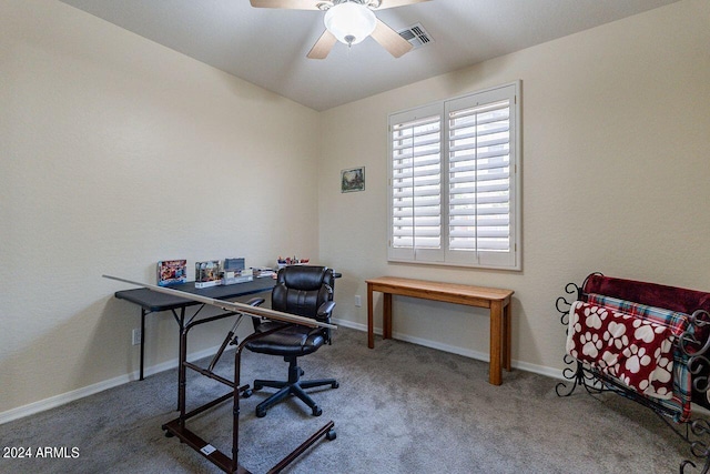 carpeted office with ceiling fan