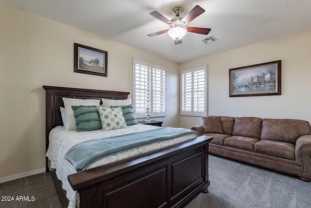 bedroom featuring ceiling fan and light carpet