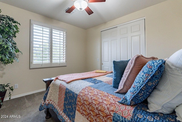 bedroom with a closet, ceiling fan, and carpet floors