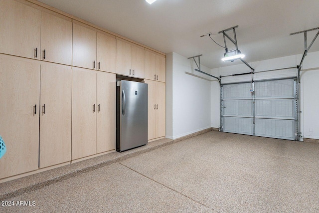 garage with stainless steel fridge