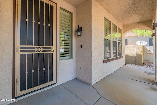 entrance to property featuring a porch