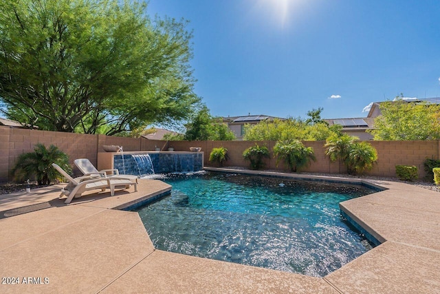 view of swimming pool featuring a patio area and pool water feature