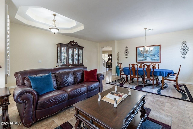 living room with a raised ceiling