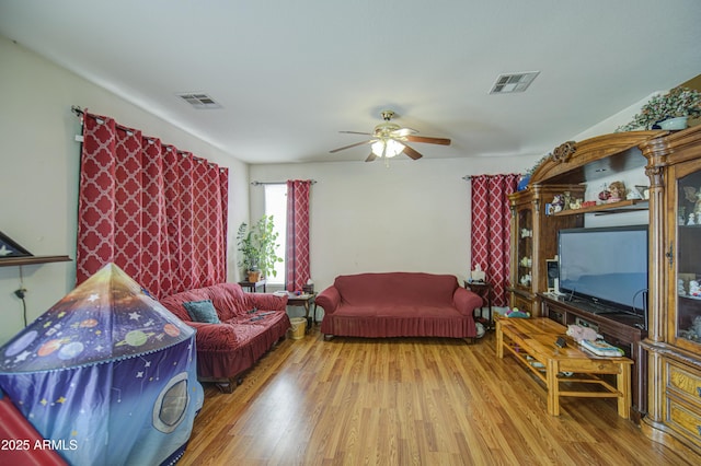703 N Redwood Ln, Buckeye, AZ 85326 - living room with wood finished floors and ceiling fan