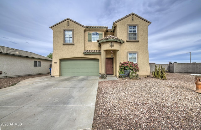 703 N Redwood Ln, Buckeye, AZ 85326 - mediterranean / spanish-style house featuring an attached garage, stucco siding, a tiled roof, and concrete driveway