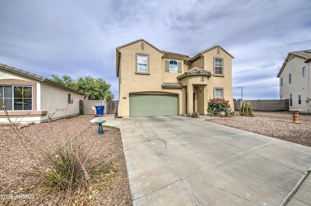 703 N Redwood Ln, Buckeye, AZ 85326 - mediterranean / spanish-style house featuring an attached garage, driveway, stucco siding, and a tiled roof