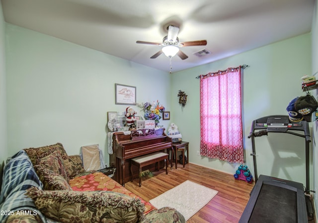 703 N Redwood Ln, Buckeye, AZ 85326 - workout area with ceiling fan and wood finished floors