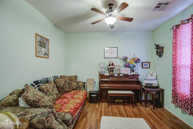 703 N Redwood Ln, Buckeye, AZ 85326 - living room with a ceiling fan and wood finished floors