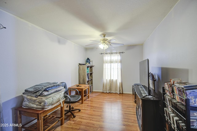 703 N Redwood Ln, Buckeye, AZ 85326 - office featuring light wood-style flooring, ceiling fan, and baseboards