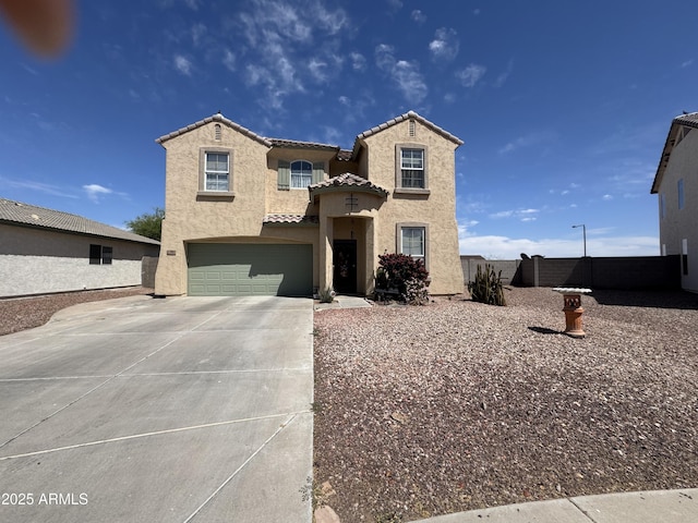 703 N Redwood Ln, Buckeye, AZ 85326 - mediterranean / spanish home featuring an attached garage, stucco siding, concrete driveway, and a tile roof