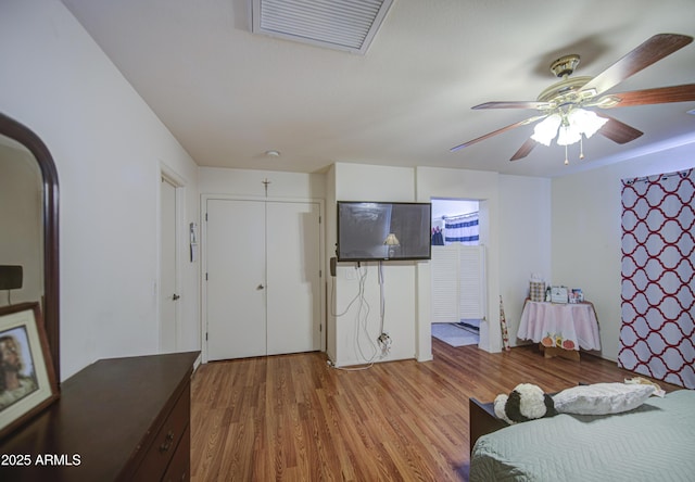 703 N Redwood Ln, Buckeye, AZ 85326 - bedroom with wood finished floors and a ceiling fan