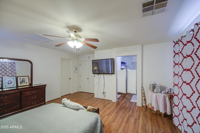 703 N Redwood Ln, Buckeye, AZ 85326 - bedroom with wood finished floors and a ceiling fan