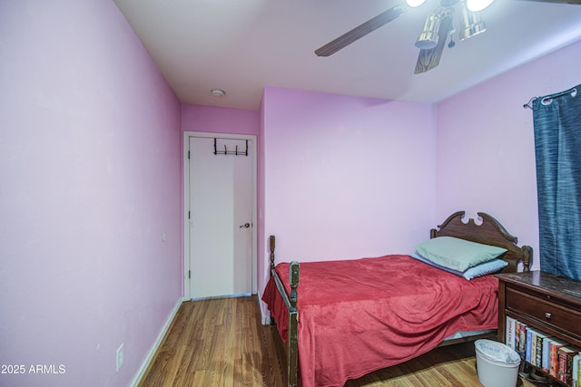 703 N Redwood Ln, Buckeye, AZ 85326 - bedroom featuring wood finished floors, baseboards, and ceiling fan