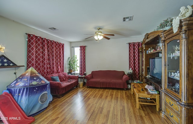 703 N Redwood Ln, Buckeye, AZ 85326 - living room featuring wood finished floors and a ceiling fan
