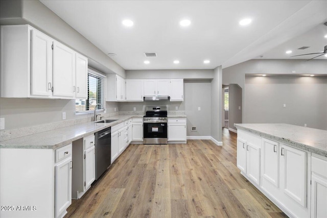 3540 S Cottonwood Dr, Camp Verde, AZ 86322 - kitchen featuring stainless steel electric range oven, a sink, dishwasher, white cabinetry, and light wood-style floors