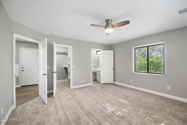 3540 S Cottonwood Dr, Camp Verde, AZ 86322 - unfurnished bedroom with light carpet, a spacious closet, baseboards, and a closet