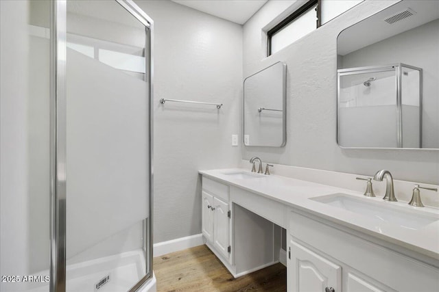 3540 S Cottonwood Dr, Camp Verde, AZ 86322 - full bath featuring a stall shower, wood finished floors, double vanity, and baseboards