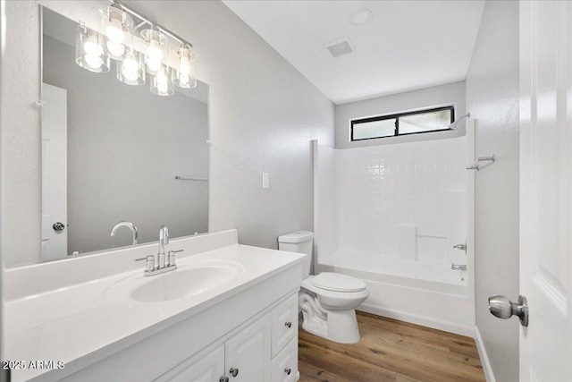 3540 S Cottonwood Dr, Camp Verde, AZ 86322 - bathroom featuring wood finished floors, toilet, vanity, and bathtub / shower combination