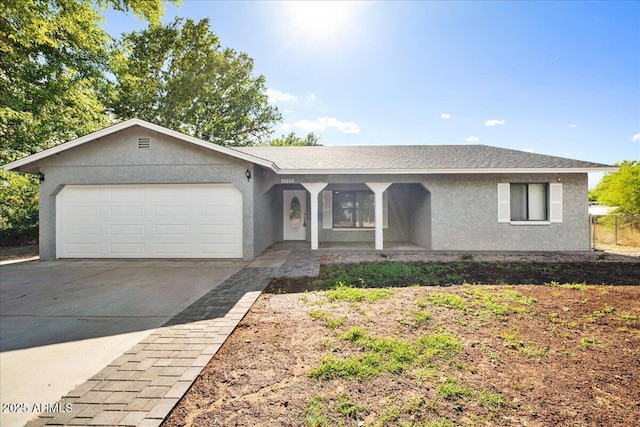 3540 S Cottonwood Dr, Camp Verde, AZ 86322 - ranch-style home featuring stucco siding, an attached garage, concrete driveway, and covered porch