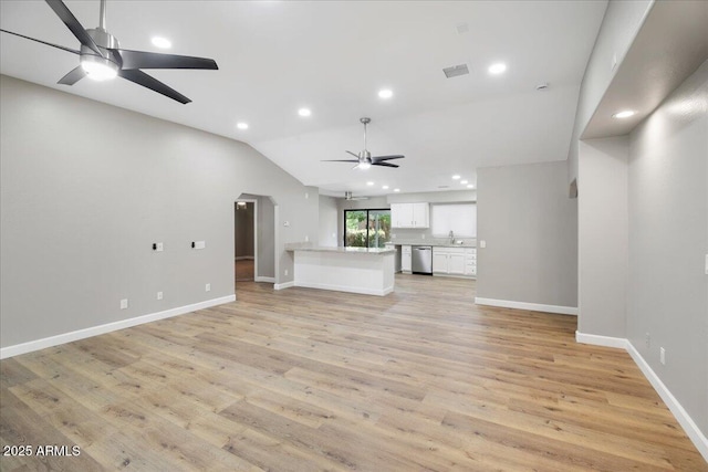 3540 S Cottonwood Dr, Camp Verde, AZ 86322 - unfurnished living room with ceiling fan, recessed lighting, vaulted ceiling, light wood finished floors, and baseboards