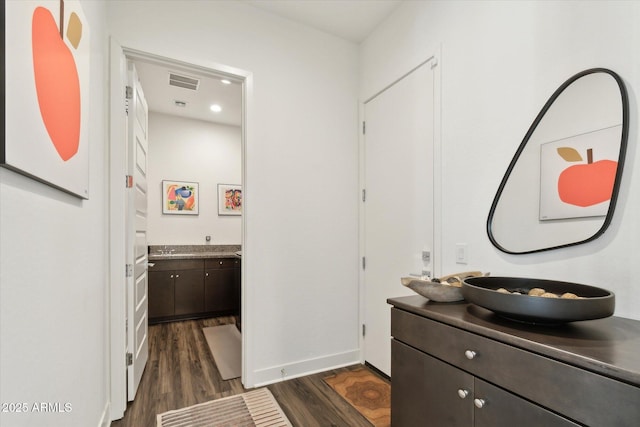 bathroom featuring hardwood / wood-style flooring and vanity