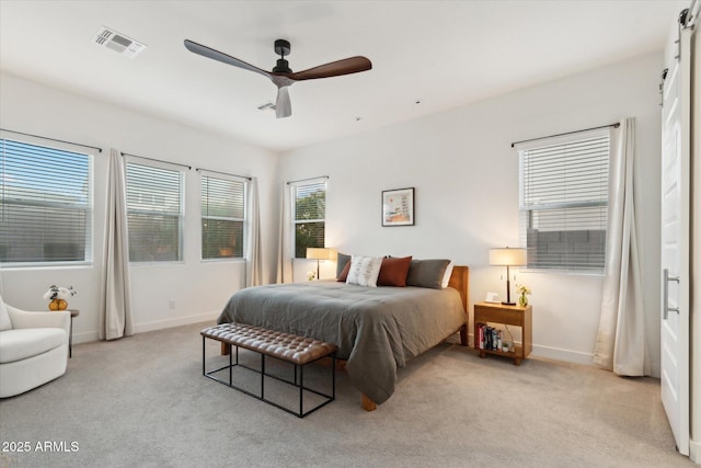 bedroom with light carpet and ceiling fan