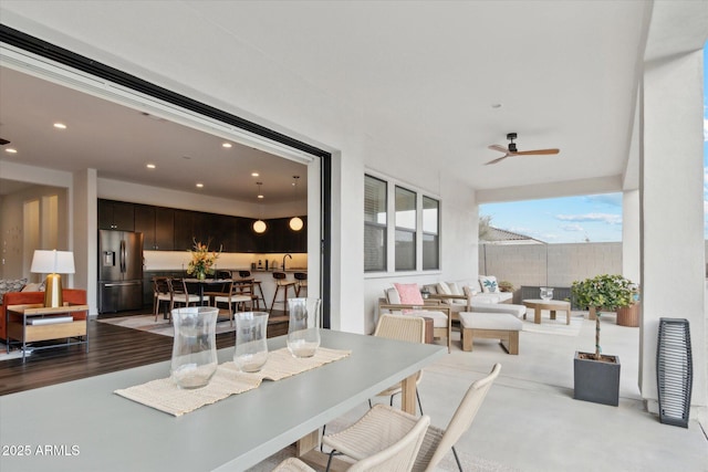 exterior space featuring sink and ceiling fan