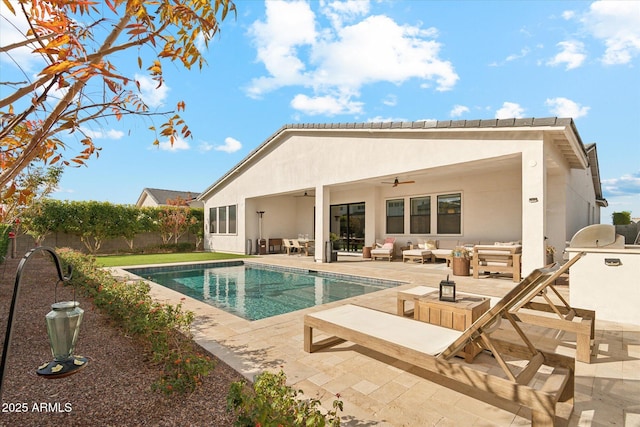 back of house with an outdoor living space, a fenced in pool, ceiling fan, and a patio area