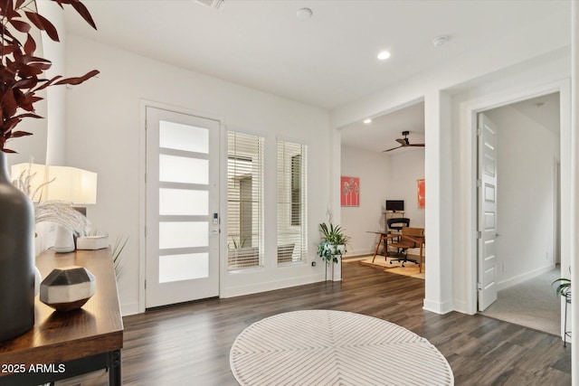 entryway with dark hardwood / wood-style flooring and ceiling fan